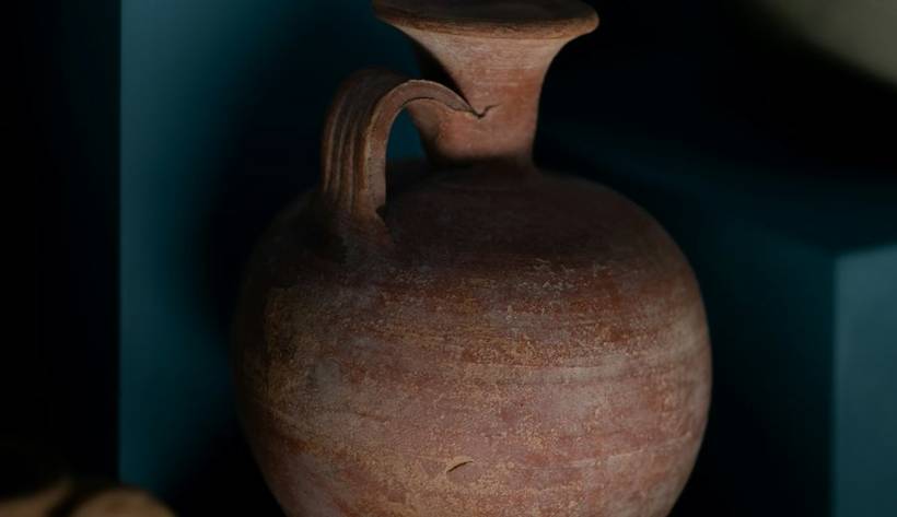 Ceramic vessel on a museum shelf